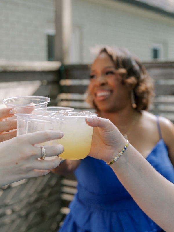 Guests toasting with citrus pours